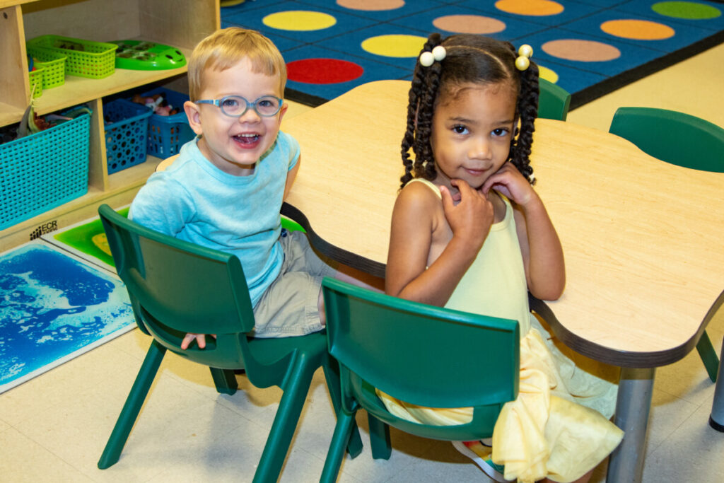Preschool boy and girl in chairs